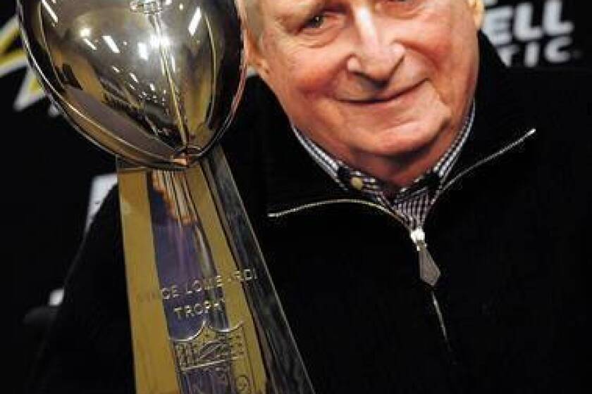 Baltimore Ravens owner Art Modell with the team's Super Bowl trophy from the 2000-01 season. The former longtime Cleveland Browns owner, who incurred the city's wrath when he moved the team to Baltimore, has died at the age of 87.