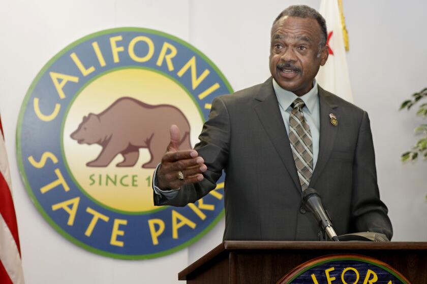 Anthony Jackson talks with reporters after being sworn in as California's parks director in November 2012.