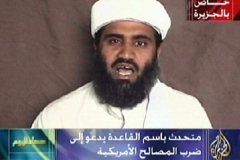 This image monitored from the Qatar-based satellite TV station al Jazeera shows the spokesman of Osama bin Laden's Al Qaeda network, Sulaiman Abu Ghaith, reading a pre-recorded message broadcast by the television station on Oct. 9, 2001. Abu Ghaith urged "all Muslims" to join in a jihad against the United States. His attorneys contend the U.S. has charged the wrong man.