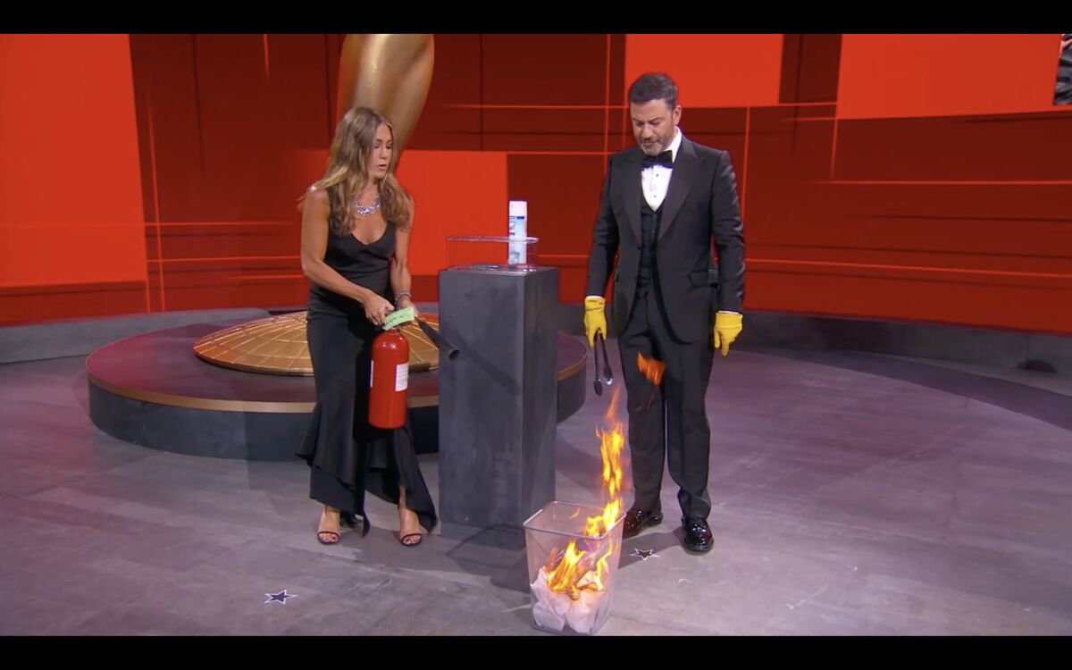 Jennifer Aniston and Jimmy Kimmel prepare to hand out the first prize of the 72nd Emmy Awards.