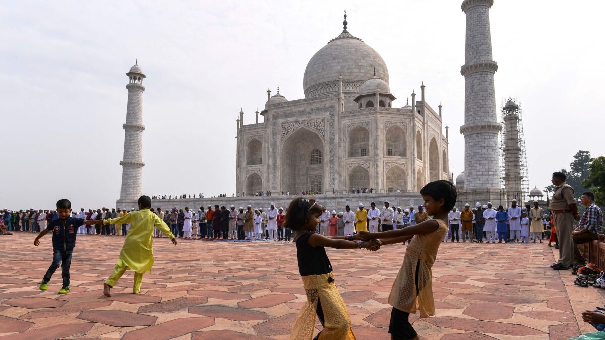 Children play in front of the Taj Mahal in Agra, India, last month.