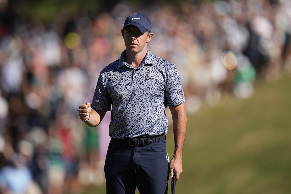 Rory McIlroy, of Northern Ireland, clinches his fist after making a putt to win his match over Xander Schauffele in a quarterfinal round at the Dell Technologies Match Play Championship golf tournament in Austin, Texas, Saturday, March 25, 2023. (AP Photo/Eric Gay)