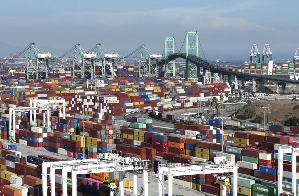 A bridge and many colorful shipping containers at the port of Los Angeles