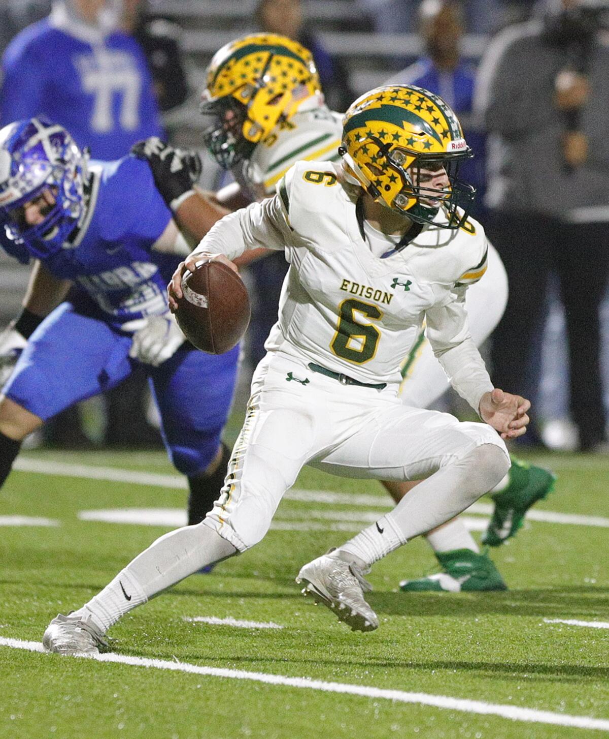 Edison quarterback Braeden Boyles cuts up the field.