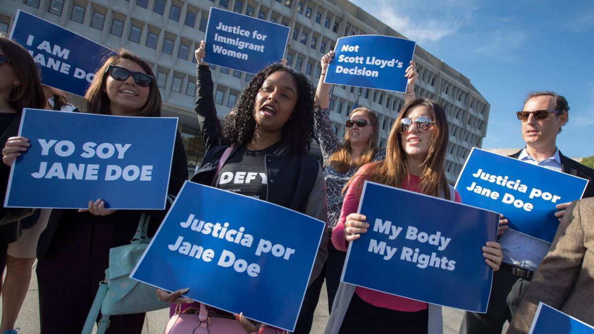 Activists demonstrate Friday outside the Department of Health and Human Services in Washington in support of a pregnant 17-year-old immigrant being held in a federal detention facility in Texas who is seeking an abortion.
