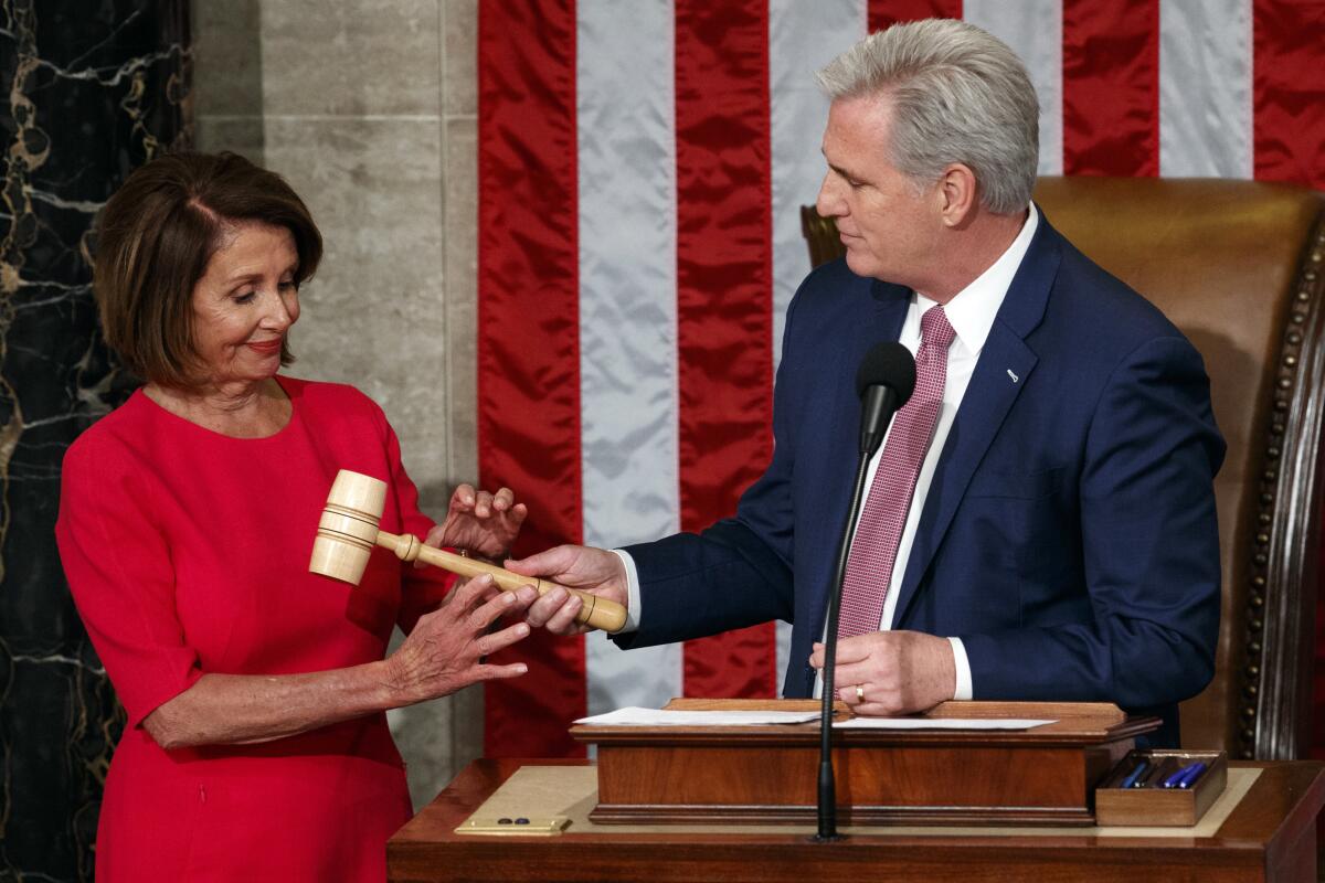 Nancy Pelosi of California takes the gavel from House Minority Leader Kevin McCarthy 