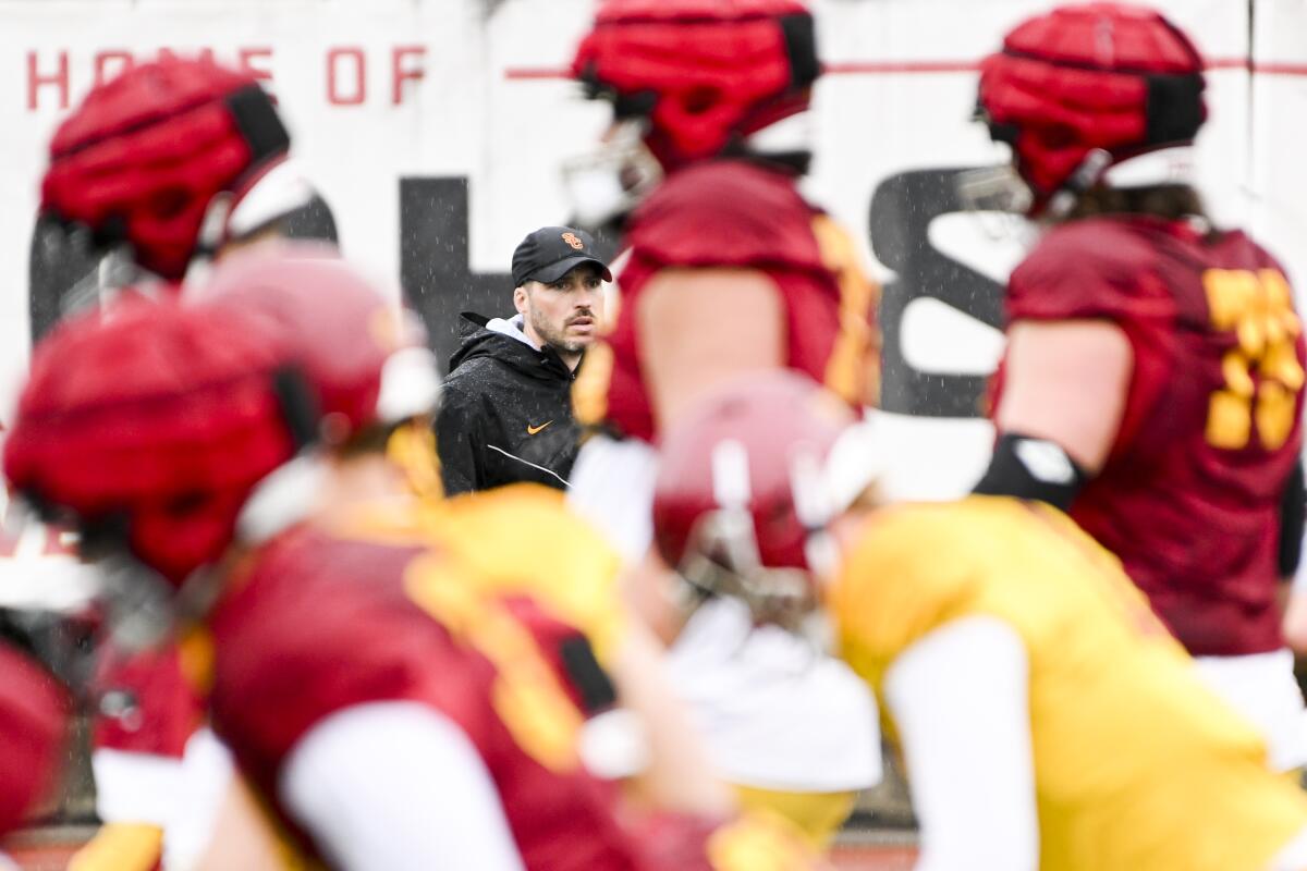 USC defensive coordinator Alex Grinch watches over during USC spring practice.