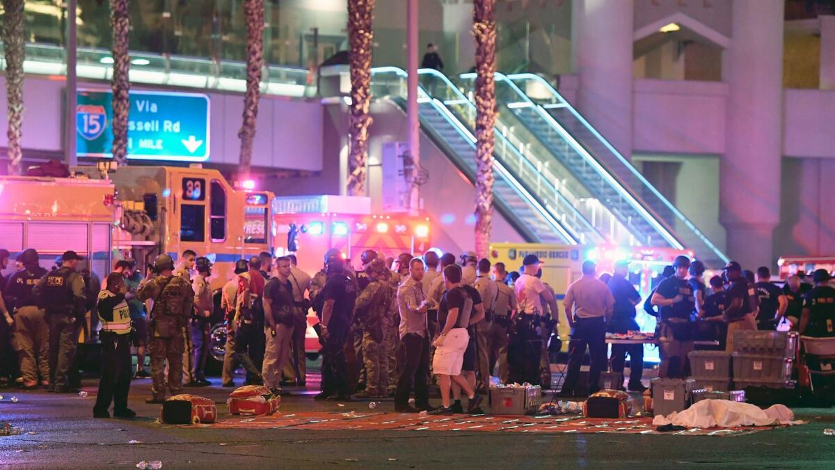 Las Vegas police and rescue personnel gather at the intersection of Las Vegas Boulevard and Tropicana Avenue after a shooting at a country music festival on Oct. 1.