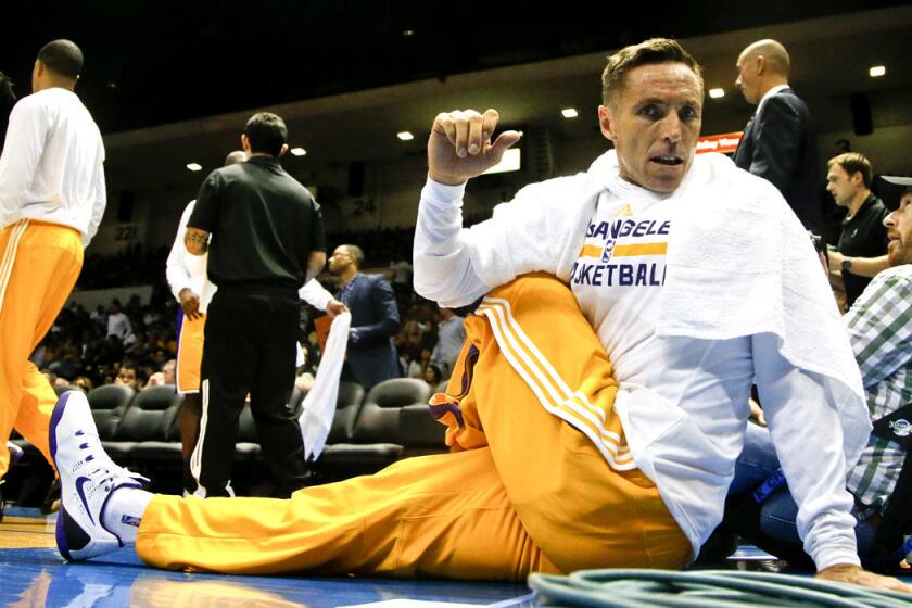 Lakers point guard Steve Nash stretches during a break in play in an exhibition game in San Diego on Oct. 6.