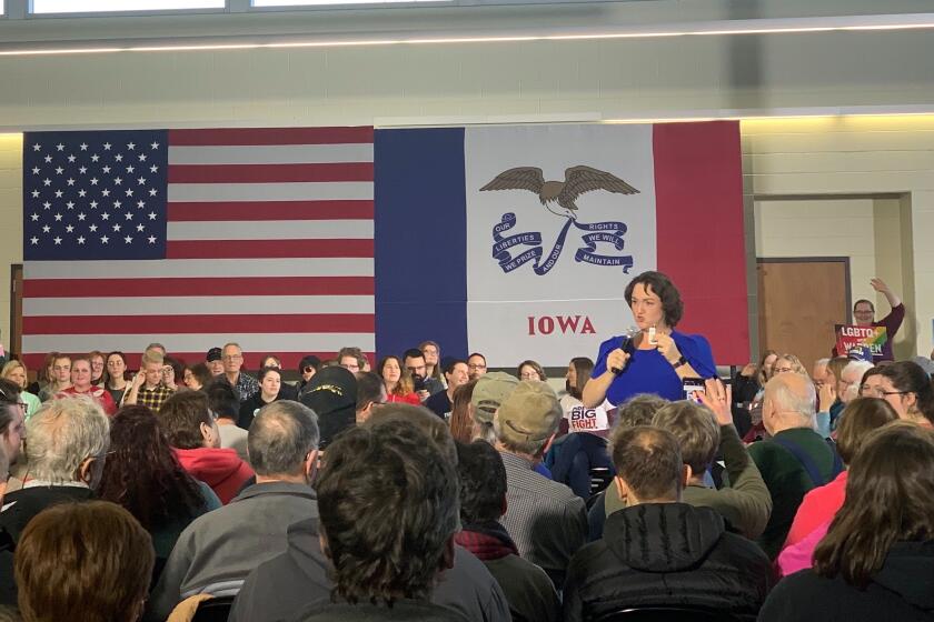 Orange Couunty Rep. Katie Porter warms up the crowd before Sen. Elizabeth Warren takes the stage at a rally in Mason City, Iowa