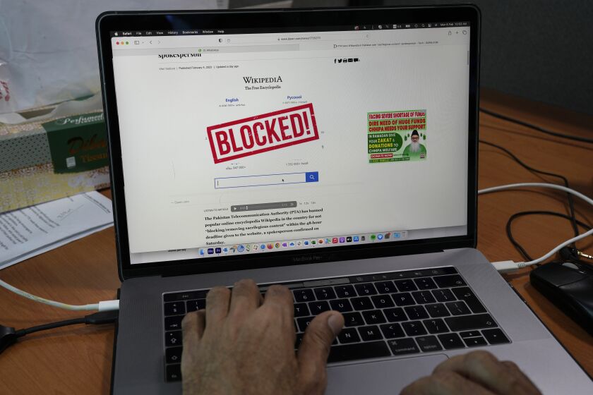 A computer screen displays a notice blocking the Wikipedia website through an online news site in Islamabad, Pakistan, Monday, Feb. 6, 2023. Pakistan's media regulator said Monday it blocked Wikipedia services in the country for hurting Muslim sentiment by not removing allegedly blasphemous content from the site. (AP Photo/Anjum Naveed)
