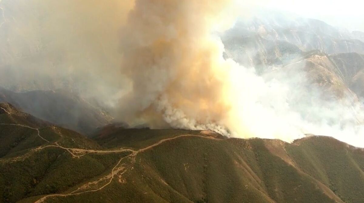The fast-moving Silverado fire burns Monday in the hills of the Cleveland National Forest.
