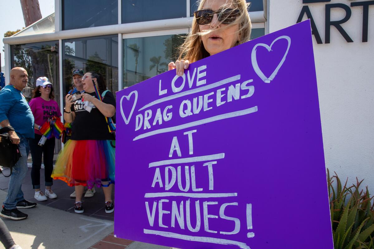 Laura Puente protests against a drag story time at the Laguna Art Museum in Laguna Beach.