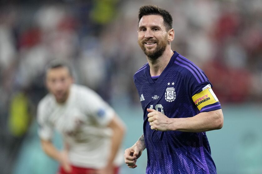 Argentina's Lionel Messi smiles during the World Cup group C soccer match between Poland and Argentina at the Stadium 974 in Doha, Qatar, Wednesday, Nov. 30, 2022. (AP Photo/Ariel Schalit)