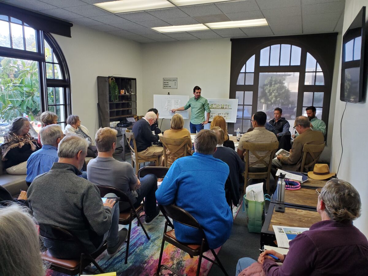 Ryan Wynn, Murfey Co. director of development, leads a discussion about the Adelante Townhomes project March 13.