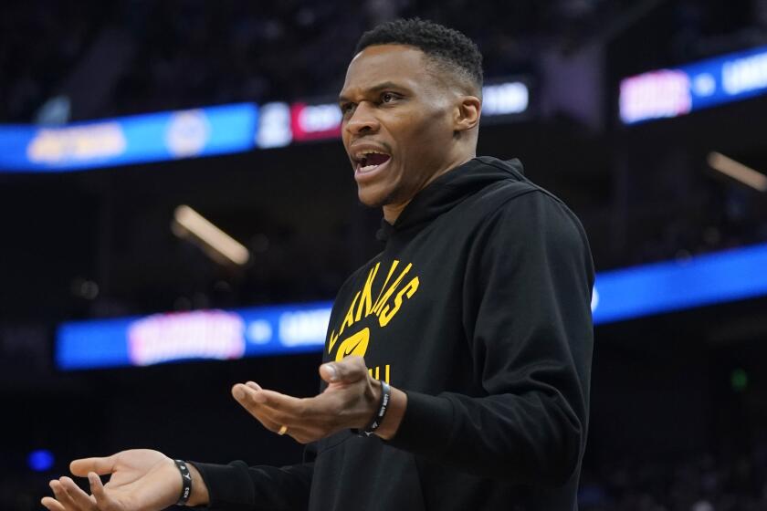 Los Angeles Lakers' Russell Westbrook gestures to officials during the first half.