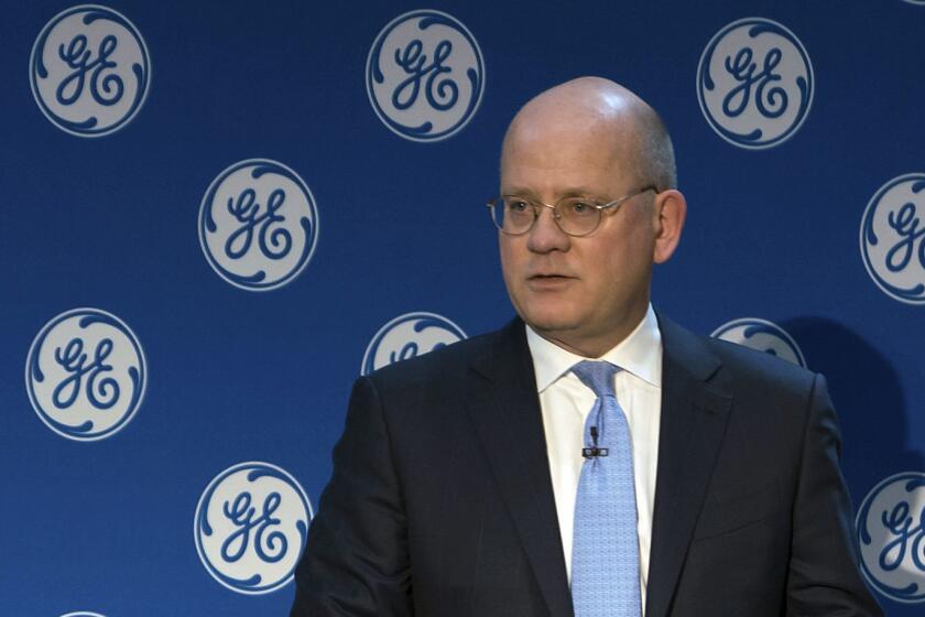 In this Monday, Nov. 13, 2017, photo provided by General Electric, GE Chairman and CEO John Flannery addresses investors at a meeting in New York. Flannery said the company is weighing the future of its transportation, industrial, and lighting businesses so that it can focus more intently on its most profitable divisions. (Eli Kabillio/General Electric via AP)