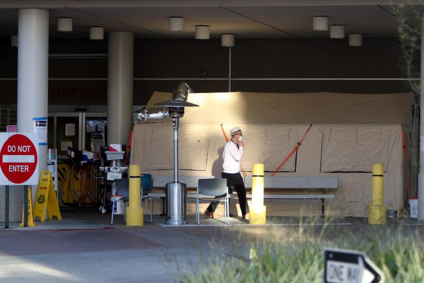A large tent is set up outside the emergency room at Adventist Health Glendale, reportedly to do in-take of suspected novel coronavirus COVID-19 patients, in Glendale on Friday, March 20, 2020.