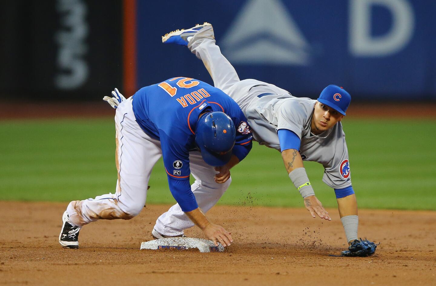 Javier Baez attempting to turn a double play