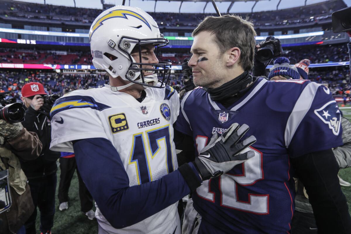 Tom Brady (right) and the Patriots eliminated the Philip Rivers and the Chargers from the playoffs two seasons ago.