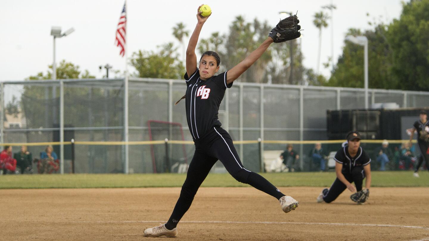 Huntington Beach High pitcher Grace Uribe throws against Los Alamitos during the first inning in a Sunset League game on Tuesday. (Kevin Chang/ Daily Pilot)