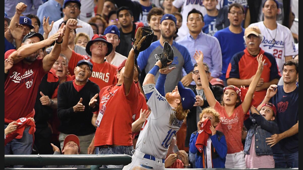 Dodgers third baseman Justin Turner makes a catch on a foul ball hit by the Nationals' Stephen Drew in the eighth inning.