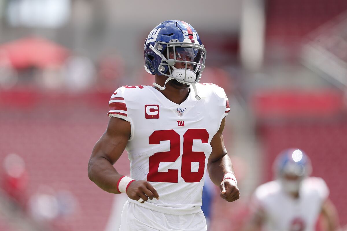 Giants running back Saquon Barkley warms up prior to a game against the Buccaneers at Raymond James Stadium on Sept. 22.