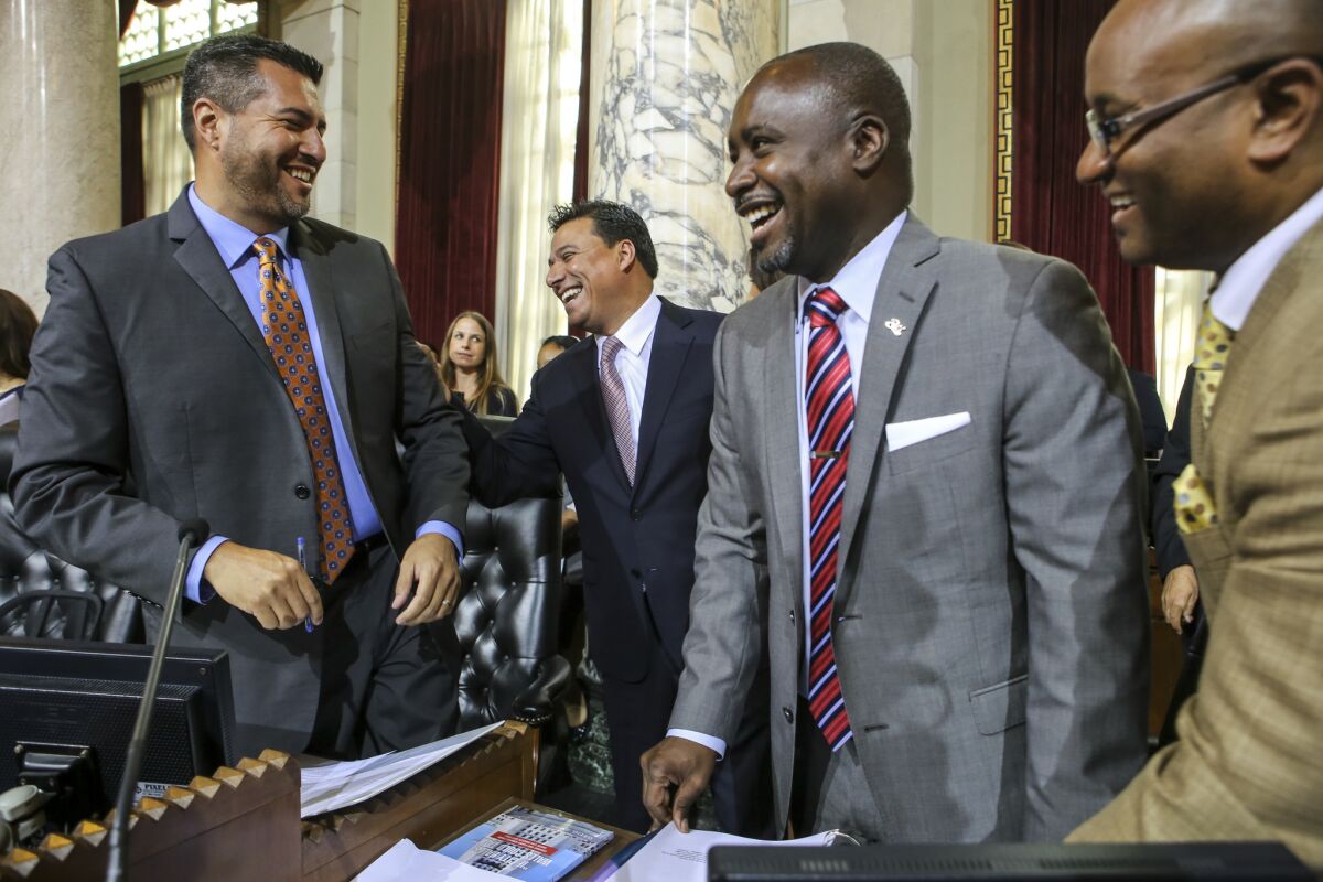 Councilman Felipe Fuentes, left, plans to leave his job representing the northeast Valley next month and become a lobbyist with the Apex Group in Sacramento.