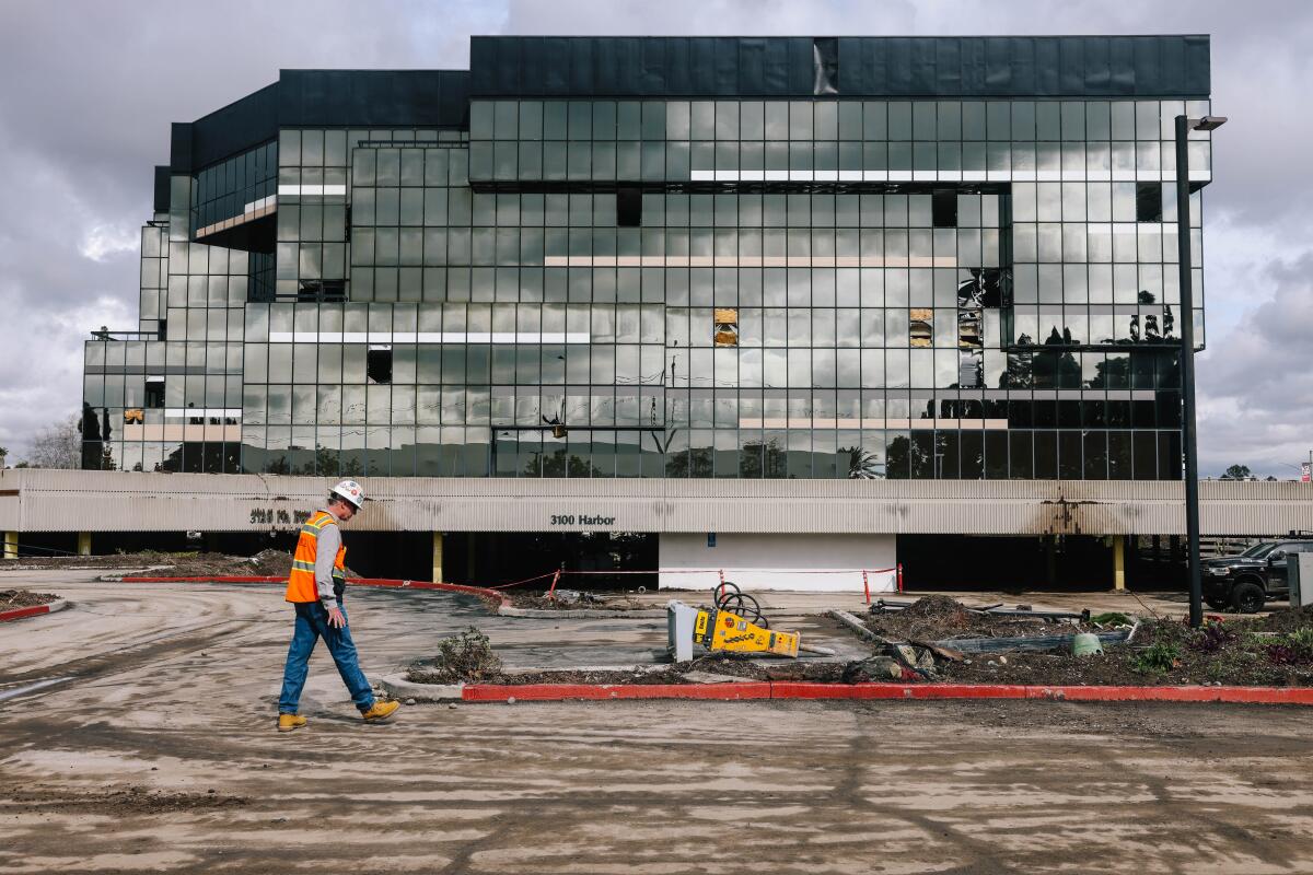 An office building is being demolished to make way for a distribution center in Santa Ana