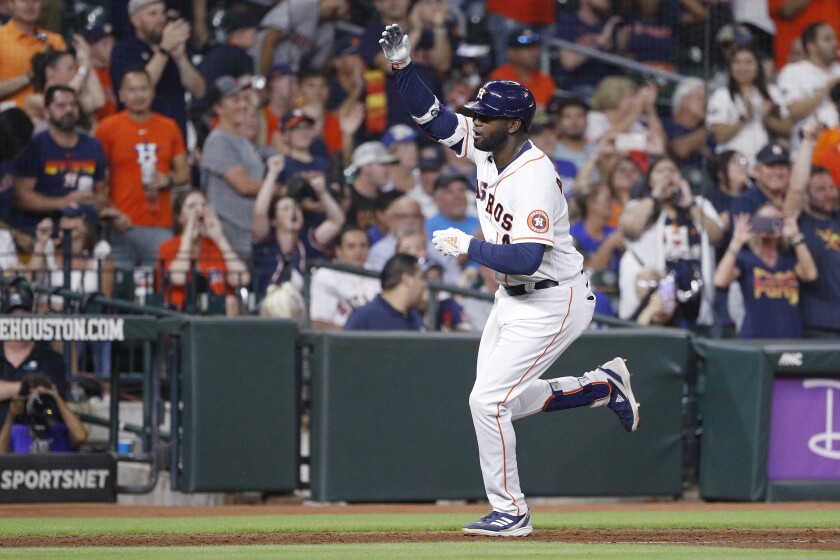 Houston Astros' Yordan Alvarez celebrates as he runs the bases after hitting a solo home run off Kansas City Royals relief pitcher Jackson Kowar during the eighth inning of a baseball game Tuesday, July 5, 2022, in Houston. (AP Photo/Kevin M. Cox)