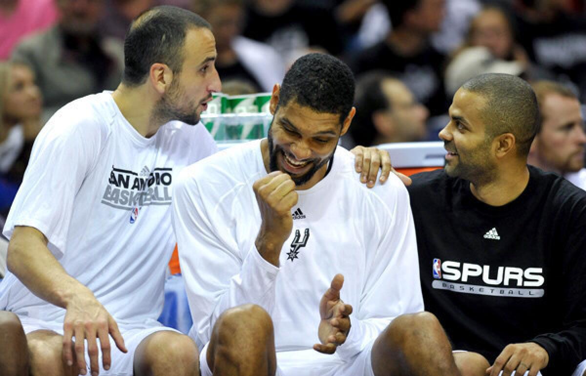 Did the Spurs' Big 3 -- from left, Manu Ginobili, Tim Duncan and Tony Parker -- just learn they get a night off from playing the Heat? No, they're yucking it up during an exhibition game in October.