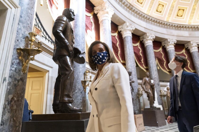House Speaker Nancy Pelosi of Calif., walks through Statuary Hall, during the vote on the Democrat's $1.9 trillion COVID-19 relief bill, on Capitol Hill, Wednesday, March 10, 2021, in Washington. (AP Photo/Alex Brandon)