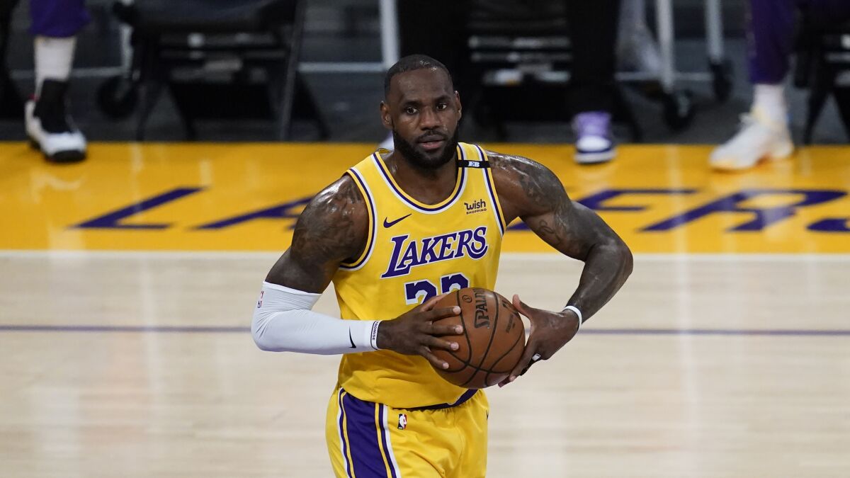 Lakers forward LeBron James controls the ball during Game 6 of the Western Conference quarterfinals.