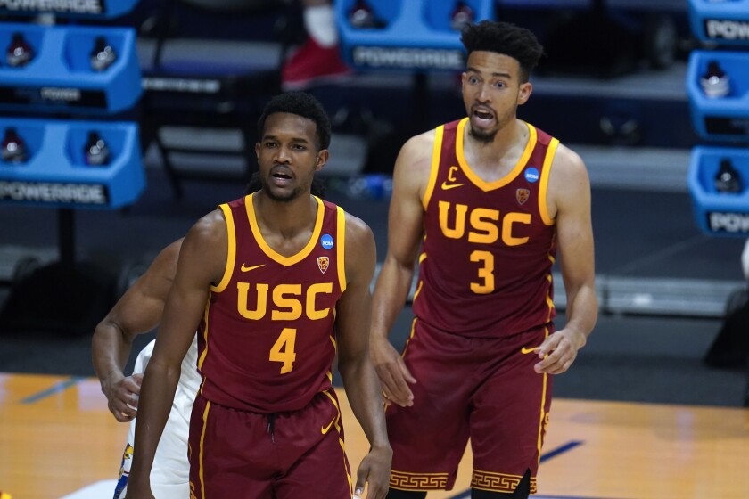 USC forward Evan Mobley, left, and Isaiah Mobley look on during a win over Kansas in the NCAA tournament in March.