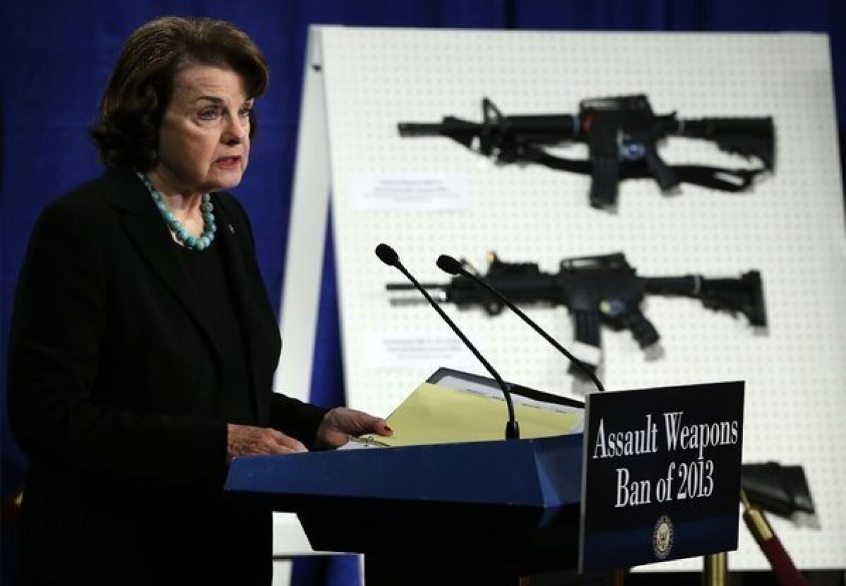 Sen. Dianne Feinstein speaks next to a display on assault weapons during a news conference in 2013. Feinstein introduced legislation Wednesday to ban the sale and possession of military-style assault weapons.
