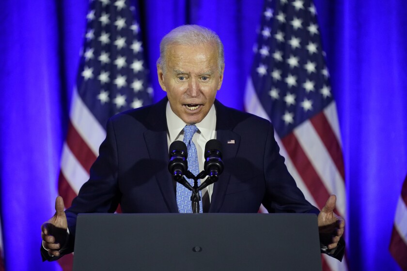 President Joe Biden speaks at a Democratic National Committee holiday party, Tuesday, Dec. 14, 2021, in Washington. (AP Photo/Patrick Semansky)