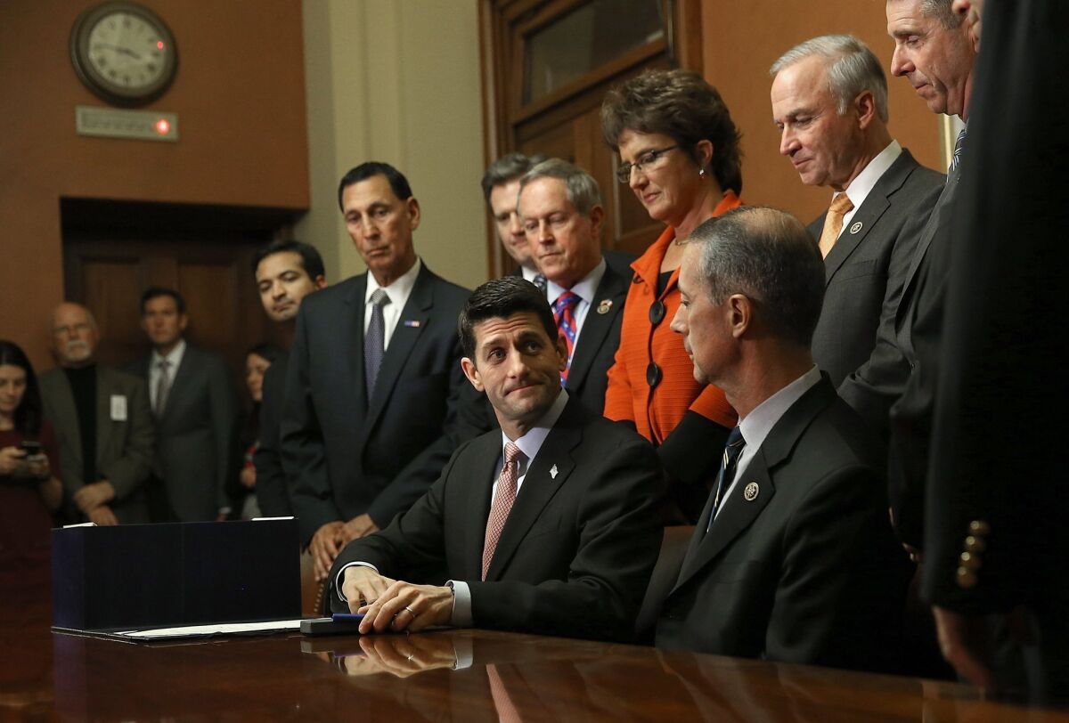 House Speaker Paul D. Ryan (R-Wis.) with Republican lawmakers on Capitol Hill.