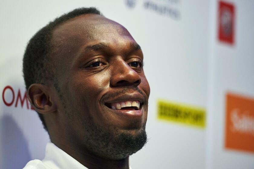 Jamaican sprinter Usain Bolt attends a news conference Thursday in London ahead of an IAAF Diamond League London event.