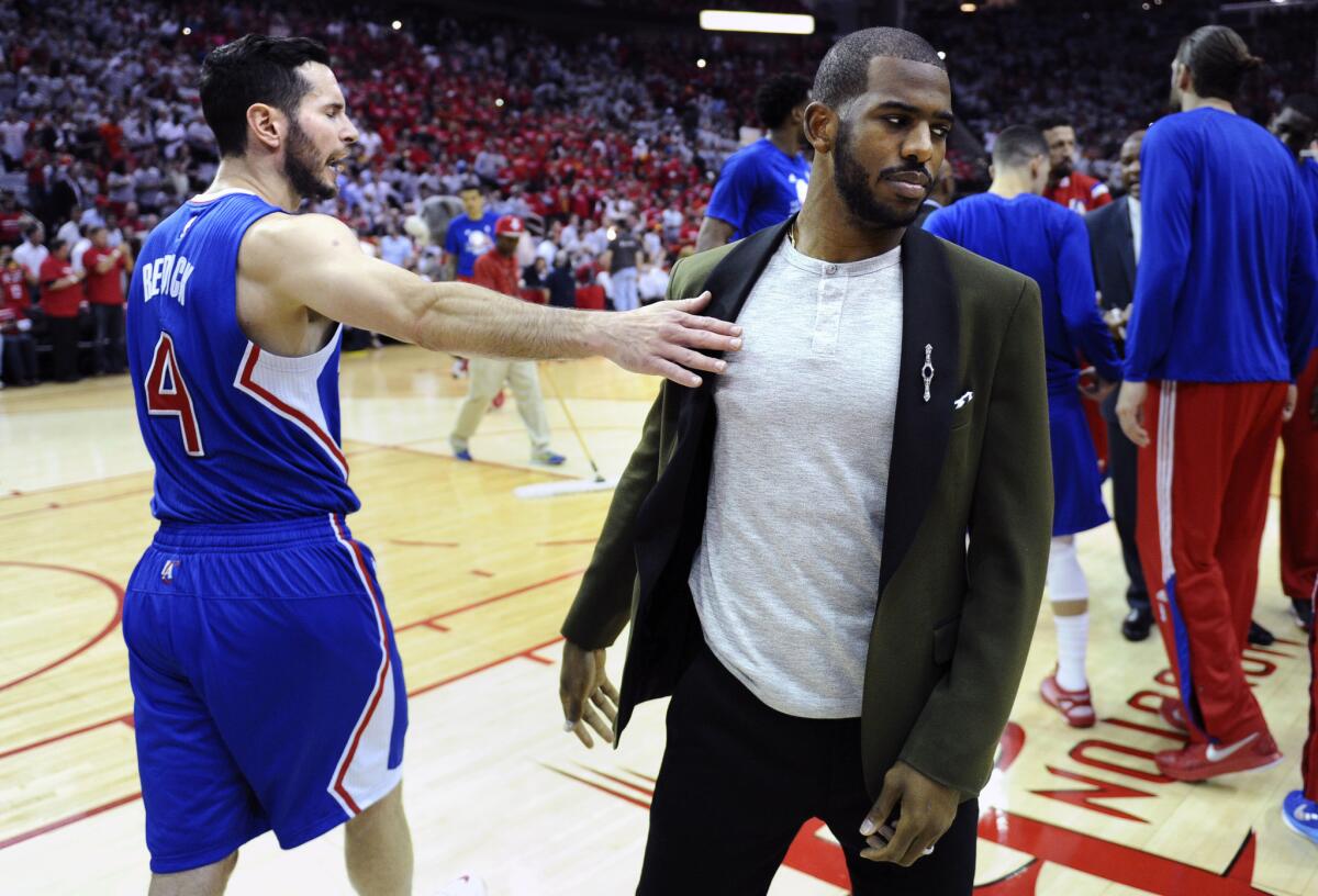 Clippers shooting guard J.J. Redick encorages teammate Chris Paul, who is out with a strained hamstring, before Game 1 with the Rockets in the second round of the NBA playoffs.