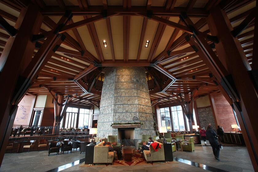 Cozy seating areas surround the stone fireplace column at the Ritz-Carlton at Northstar.