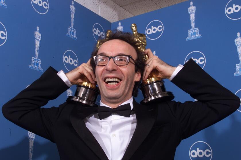 Roberto Benigni at the 71st annual Academy Awards, at the Dorothy Chandler Pavillion, Sunday, March 21, 1999.Photo/Art by:Ken Hively