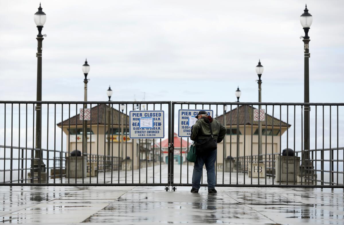 The Huntington Beach Pier is closed to prevent gatherings of people close together as a measure against spreading the COVID-19 coronavirus.