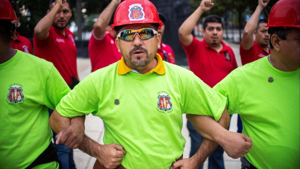Members of a Mexican miners union take part in a demonstration in support of Sen. Napoleon Gomez Urrutia.
