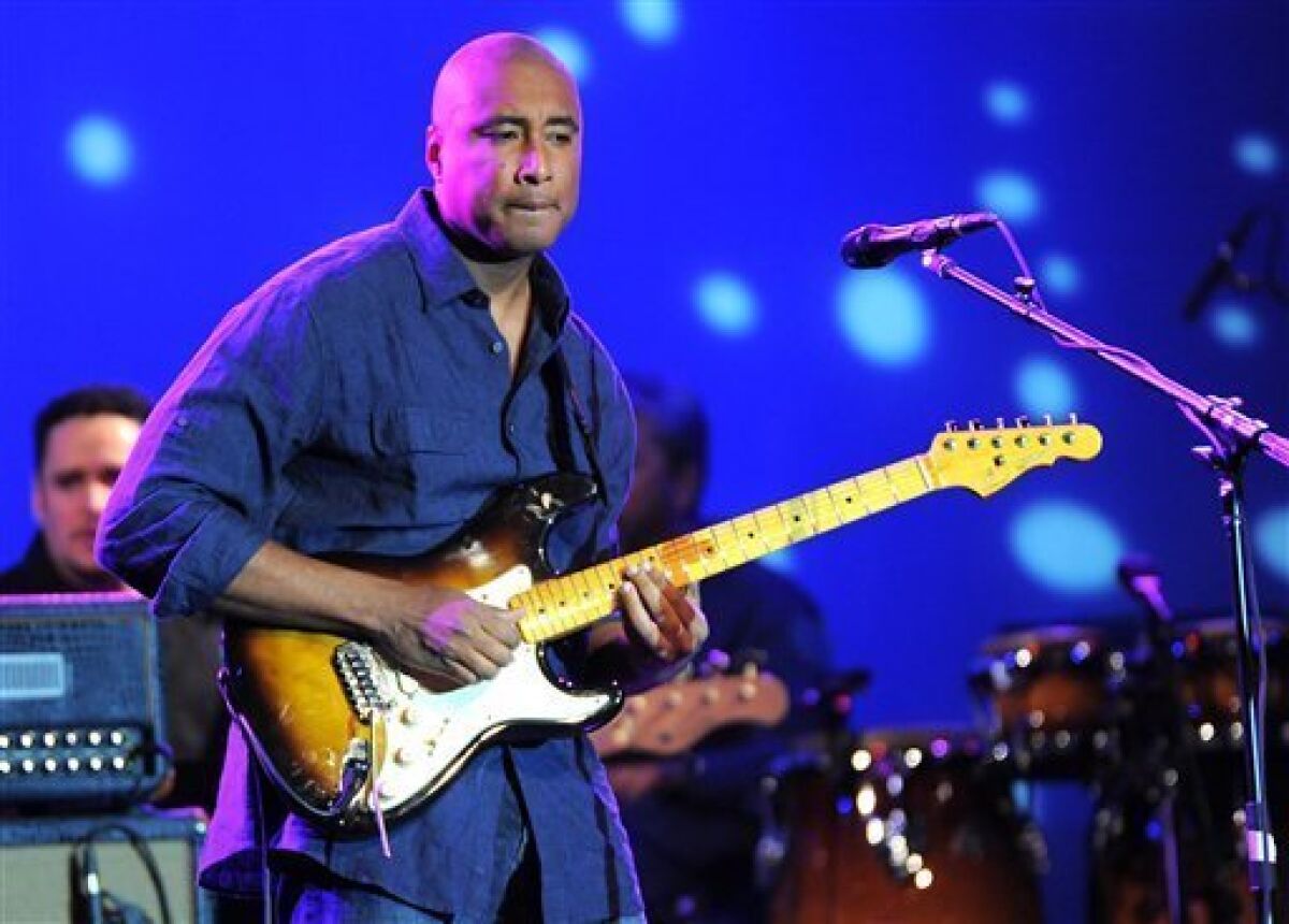 FILE - In this April 18, 2009 file photo, former New York Yankee, guitarist and songwriter Bernie Williams performs at the Nokia Theatre in New York. (AP Photo/Evan Agostini, file)