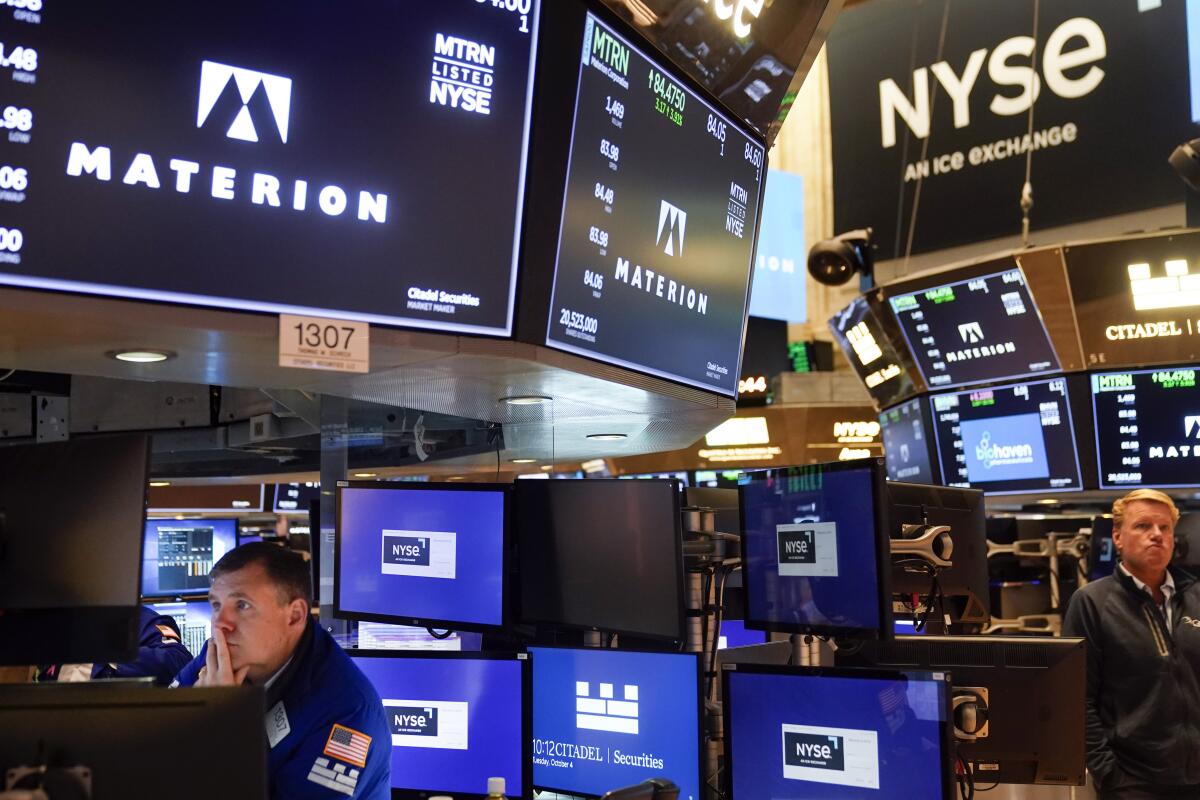 Traders work on the floor at the New York Stock Exchange 
