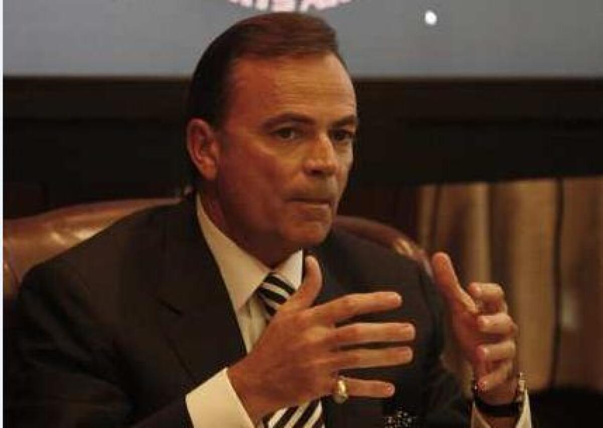 Commissioner Rick Caruso speaks at a meeting of the Los Angeles Memorial Coliseum Commission in December 2010.