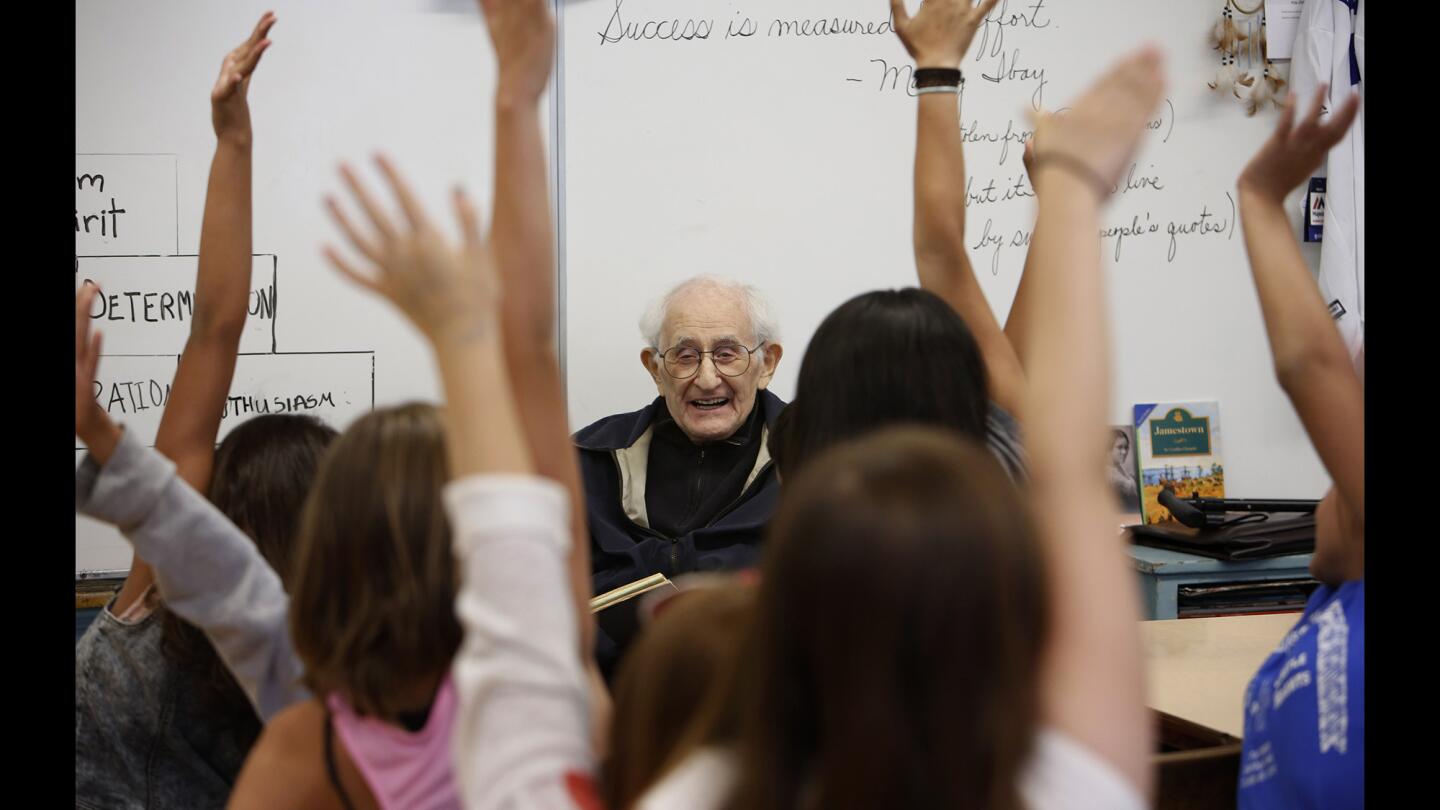 Mel Feuer, a retired teacher and principal, and a survivor of WWII and Stalag 17, visits a fifth grade classroom at Castle Heights Elementary School. Mel has been volunteering at schools for decades since his retirement.