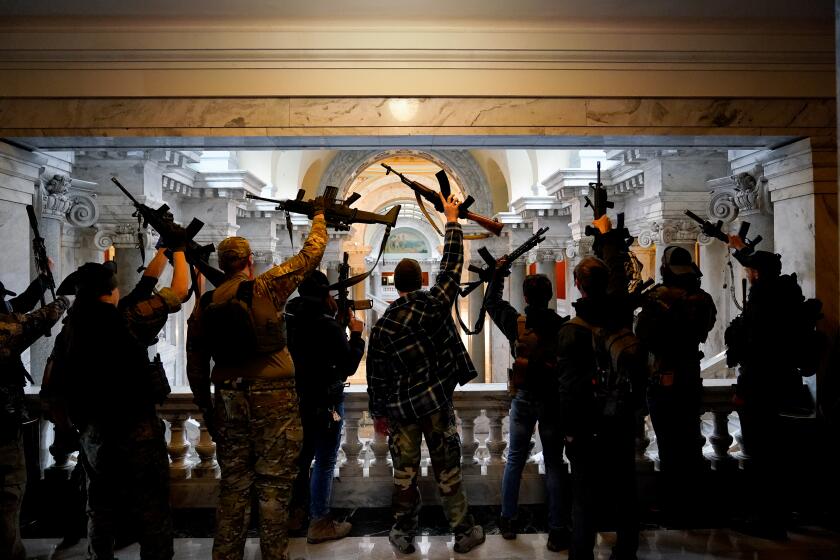 FRANKFORT, KY - JANUARY 31: Gun rights activists carrying semi-automatic firearms pose for a photograph in the Capitol Building on January 31, 2020 in Frankfort, Kentucky. Advocates from across the state gathered at the Kentucky Capitol in support of the Second Amendment. The rally will include speeches from Rep. Thomas Massie (R-KY) and former Washington, D.C. Special Police Officer, Dick Heller. (Photo by Bryan Woolston/Getty Images)