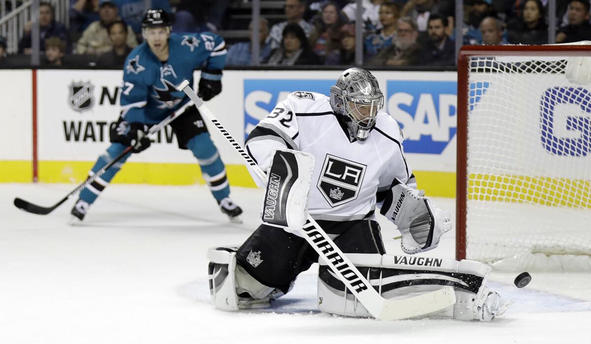 Kings goalie Jonathan Quick deflects a shot on goal against the San Jose Sharks during the first period on Oct. 12. He would later leave the game because of an injury.