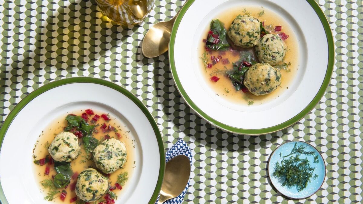 A blend of Swiss chard, pine nuts and currants flavors matzo balls in a roasted lemon broth.